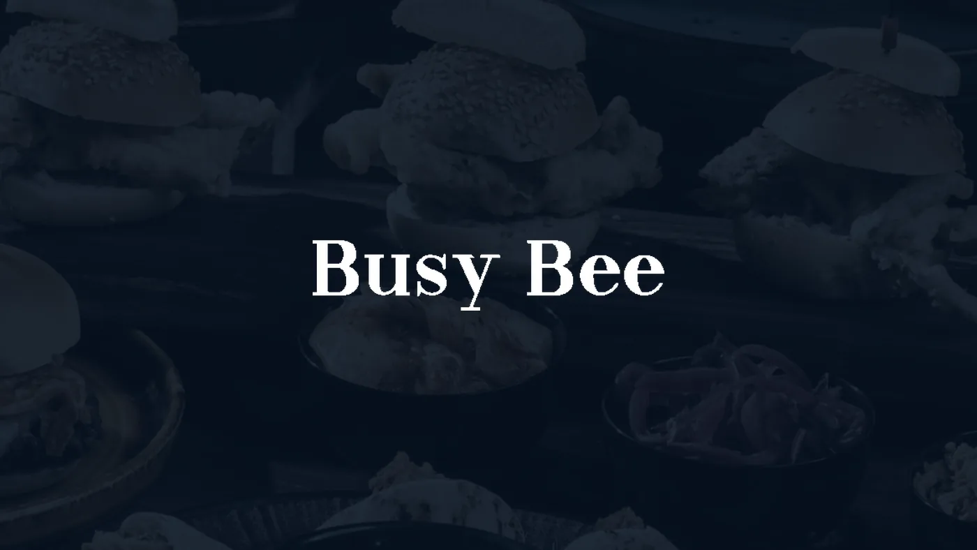 Busy Bee logo over a catering spread